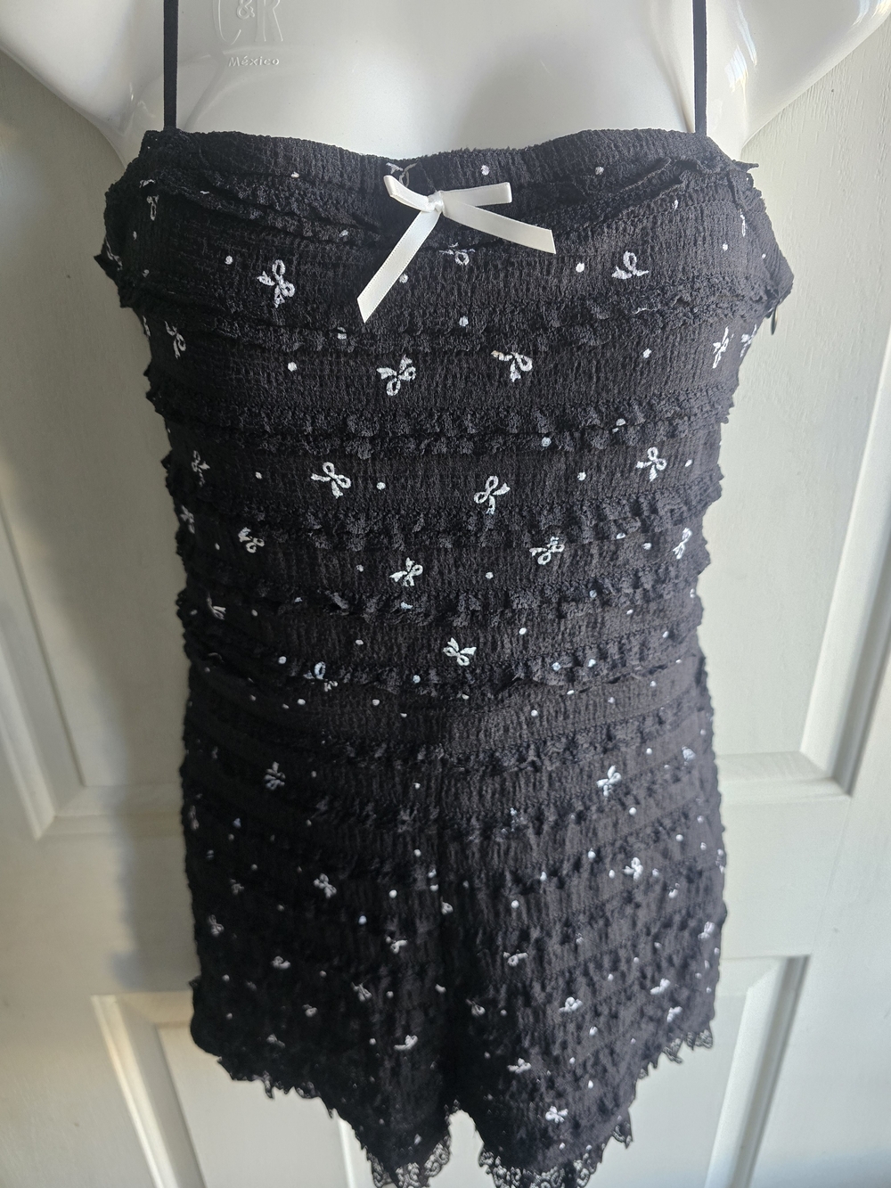 Fashion Nova Black Smocked Strap Romper with White Bow Accents